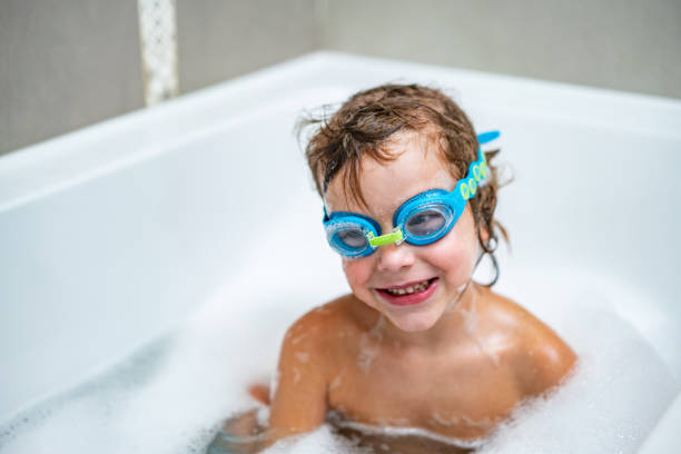 istock Boy with swimming goggles in bathtub 1222107868