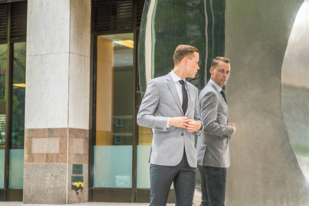 istock Young European Businessman Man looking at mirror 1222107874