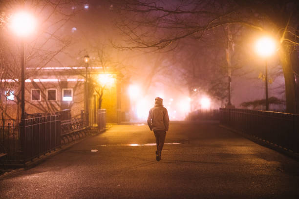 Man Walking down an empty Street in New York city, Tompkins square park lower east side