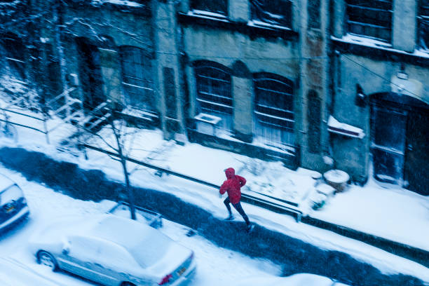 istock Man running in winter in New York 1222110032