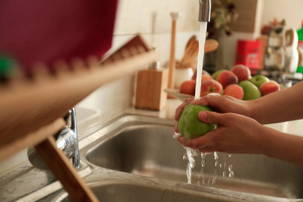 istock Washing and cleaning Fruits 1222111375