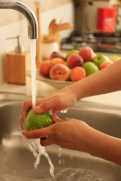 istock Washing and cleaning Fruits 1222111382