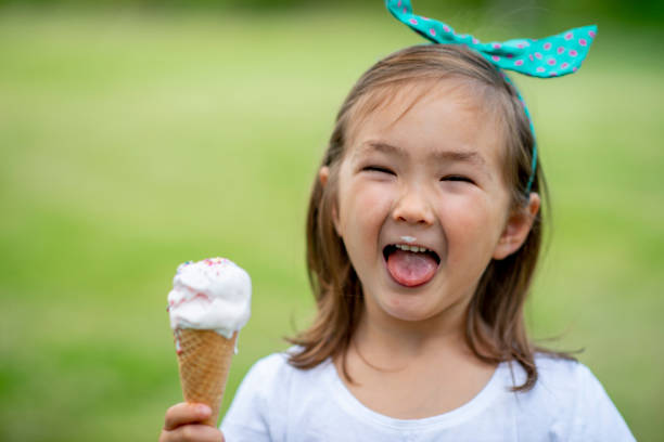 istock Cute kids eating ice cream 1222112258