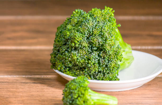 istock green broccoli in white ceramic dishes wood table 1222112804