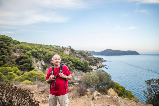 istock Senior Male Backpacker Enjoying Late Summer Coastal Hike 1222113650