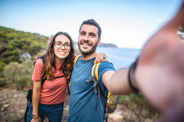 istock Smiling Spanish Hikers Taking Selfie on Mediterranean Coast 1222113710