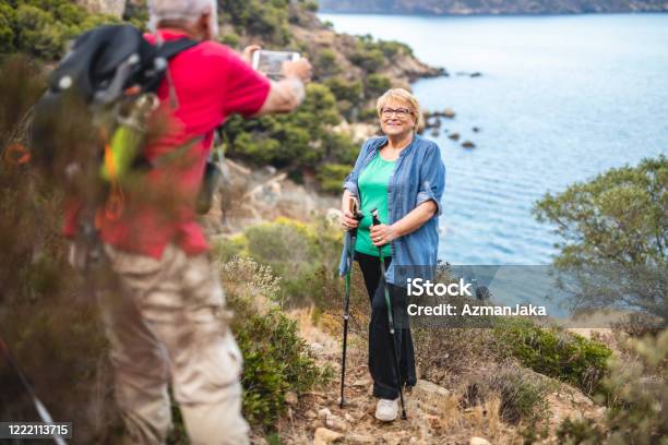 Hiking tourism adventure. Backpacker hiker woman looking at
