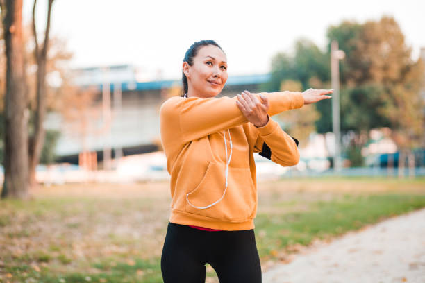 istock Mature woman stretching outside 1222113788