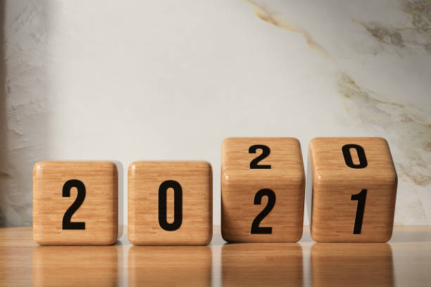 cubes turning from year 2020 to 2021 in front - 3D rendered illustration