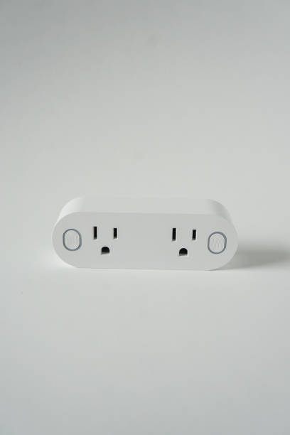 istock This double smart WIFI plug outlet can switch an electric device on or off via wi-fi. Isolated on a vertical white background with copyspace or empty room space for text or copy. 1222117061