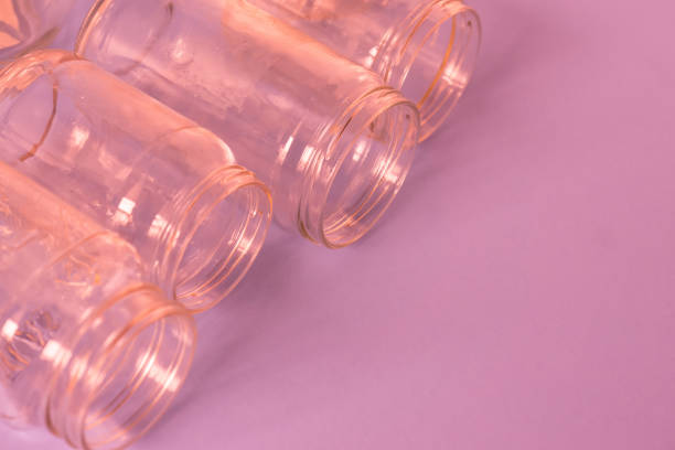 istock 4 several pink jars on an isolated pink background with copyspace or blank empty room space for text or copy. 1222117195