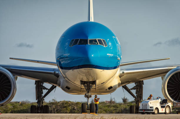 KLM aircraft frontview Kralendijk, Bonaire-April 26, 2020: KLM arrived on Bonaire with the B777-300ER to bring passengers from the Netherlands. This is a frontview of the nose and engines of the aircraft. klm stock pictures, royalty-free photos & images