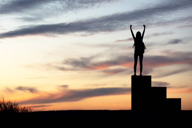 istock Man with arms outstretched celebrate mountains sunrise 1222121451