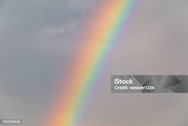 Rainbow In The Sky Against The Dark Storm Clouds Stock Photo - Download Image Now - Beauty, Cloud - Sky, Dark