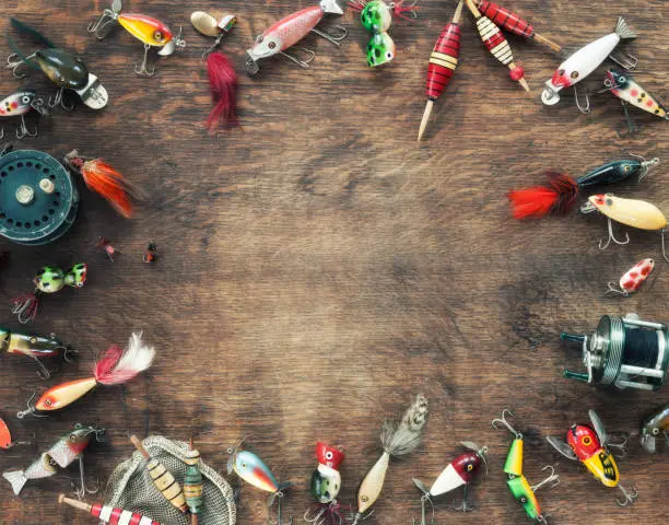 Vintage Fishing Lures on an Old Wood Background