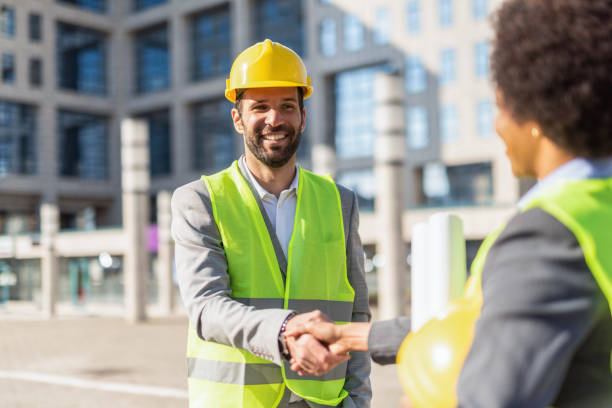 istock Construction Business Director shaking hands with an Engineer. 1222132269