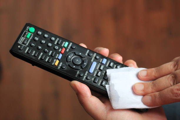 istock Cleaning and disinfecting TV remote control 1222132981