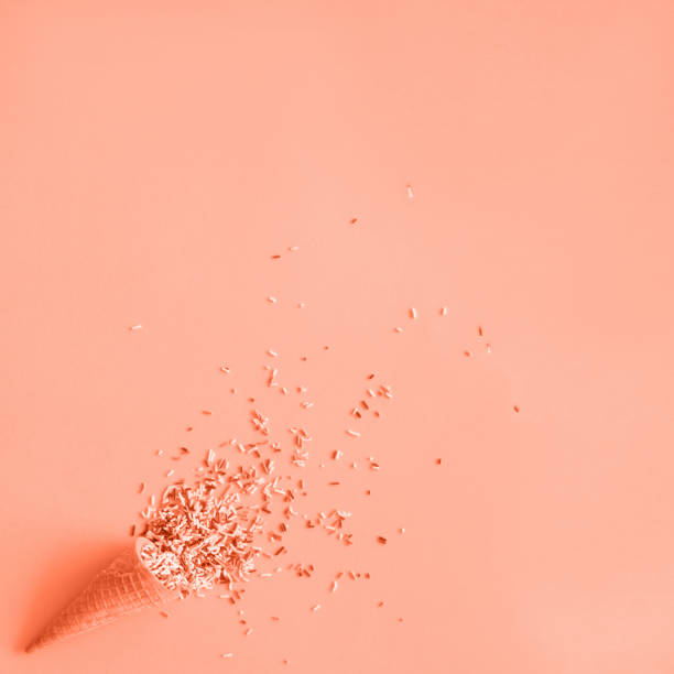 istock Wafer cone with sprinkles on pastel background 1222143607