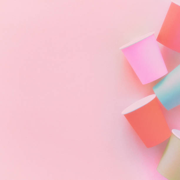 istock Colored paper cups on pastel background 1222143682