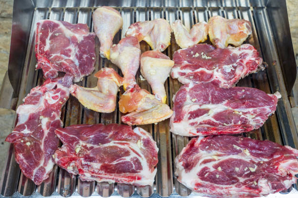 istock Chicken and pork meat on the barbecue 1222151103