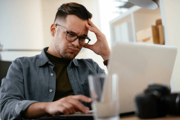 istock Young businessman working on lap top. 1222151203