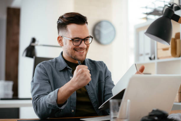 istock Young businessman working on lap top. 1222151247