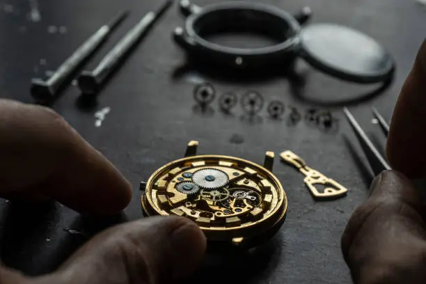 Mechanical watch repair. Watchmaker is repairing