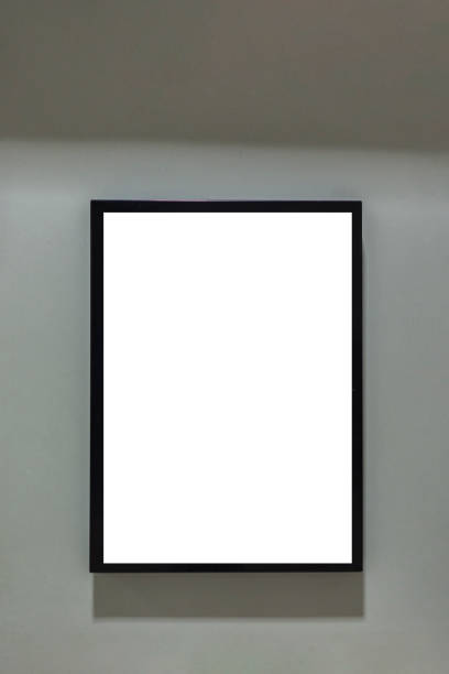istock Mock up. Blank billboard, poster frame, advertising on the the wall inside shopping mall 1222156739
