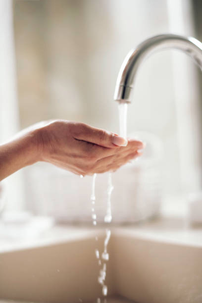 istock Young  happy women in bathrobe wash her face. 1222156957