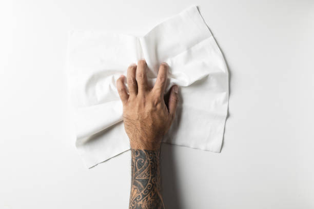 istock top view of hand with white cleaning rag isolated on white background 1222157413