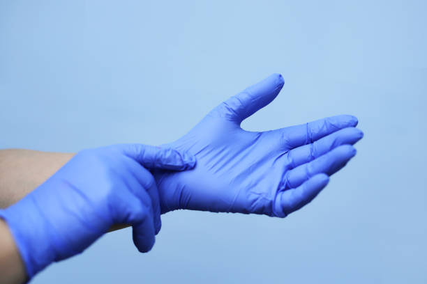 istock Human hands with blue protective gloves stock image 1222157541