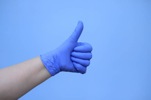 istock Human hands with blue protective gloves stock image 1222157549