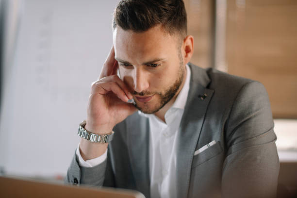 istock Handsome businessman working on lap top. 1222160420