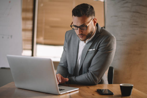 istock Handsome businessman working on lap top. 1222160970