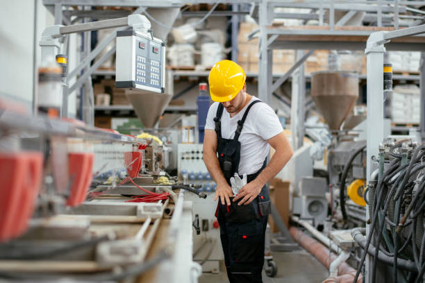 istock Young handsome man working in factory. 1222161597