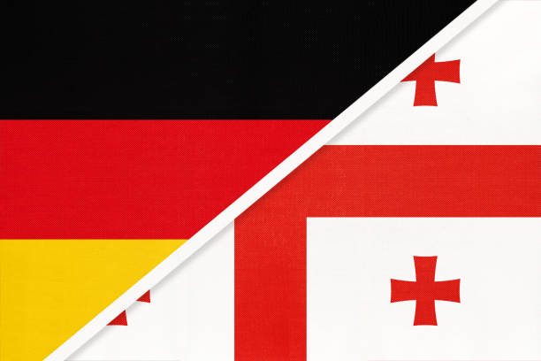 Germany vs Georgia, symbol of two national flags. Relationship between European and Asian countries. Federal Republic of Germany vs Georgia, symbol of two national flags from textile. Relationship, partnership and championship between European and Asian countries. georgia football stock illustrations