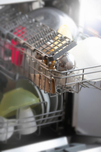 istock Dishes on Shelves of Washing Machine 1222164273