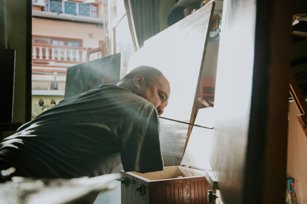 istock portrait of Thai artist men, without arms while working 1222167174