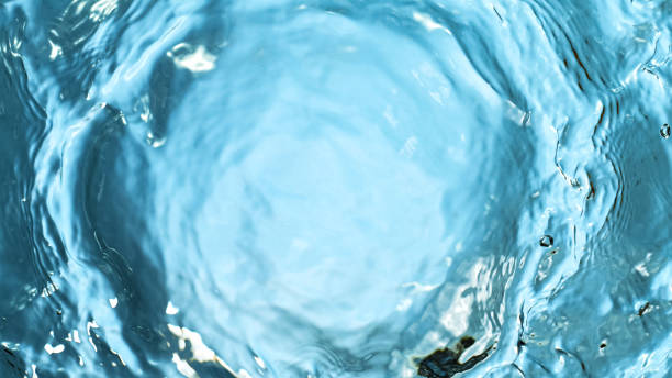 istock Water splashing on blue background 1222168243
