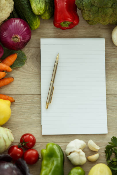 istock Checking your notebook to prepare a healthy recipe with fresh vegetables 1222168581