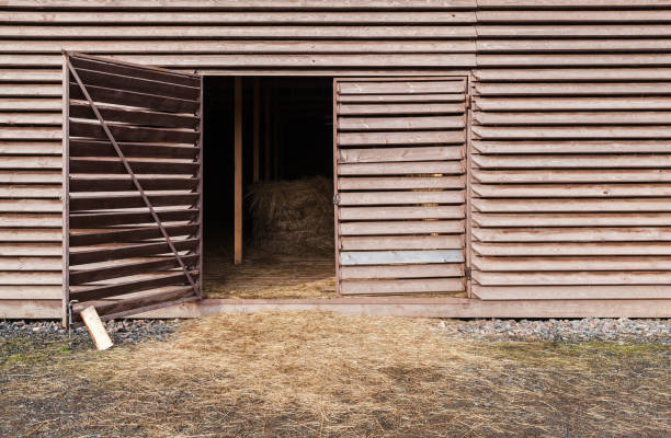 istock Open gate of an old wooden barn, rural architecture 1222168730