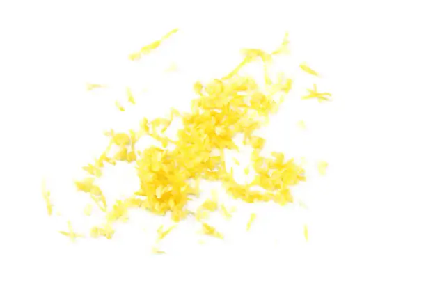 Photo of lemon zest isolated on white background. healthy food