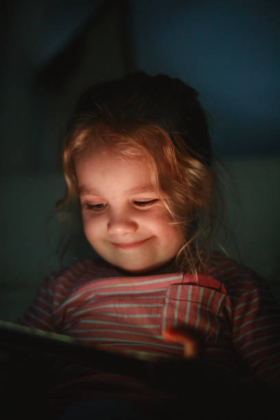 istock Everything is happiness for this little girl when watching cartoons 1222171448