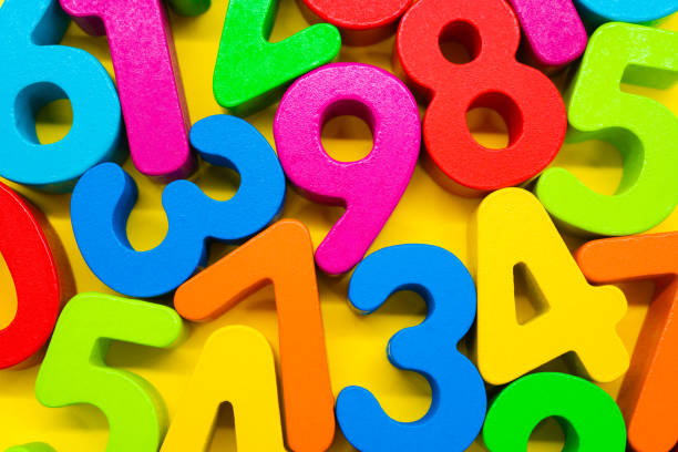 istock Colorful numbers on yellow background 1222172080