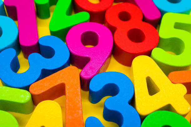 istock Colorful numbers on yellow background 1222172081