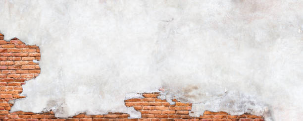 istock Damaged plaster wall background. Antique brick wall under concrete texture. 1222172177