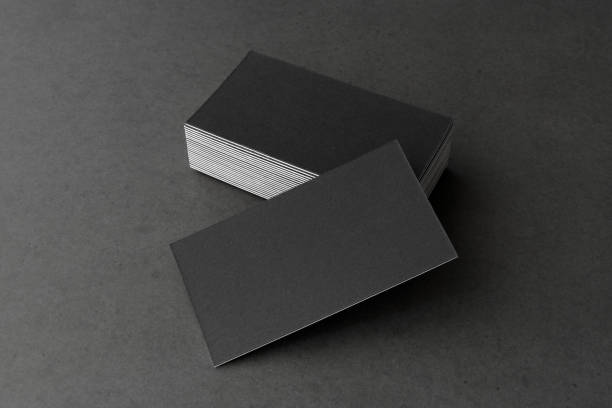 istock Business card on black background. 1222172247