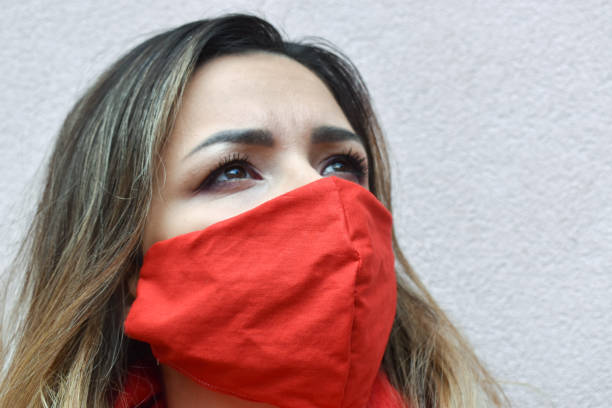 istock Woman outdoors with a red homemade face mask 1222176766