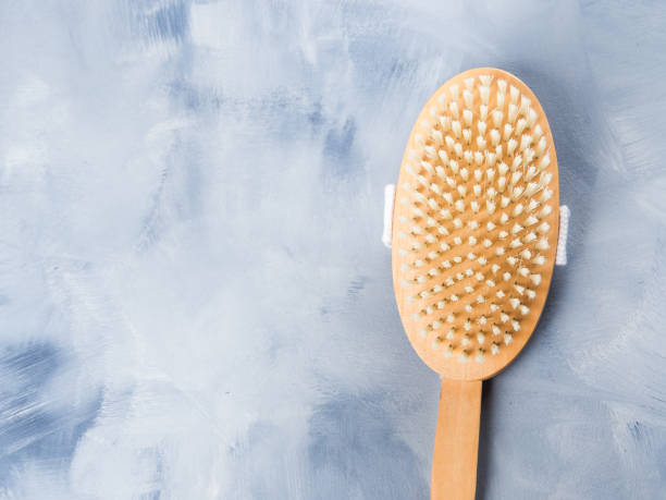 istock Wooden dry massage brush on blue 1222177605