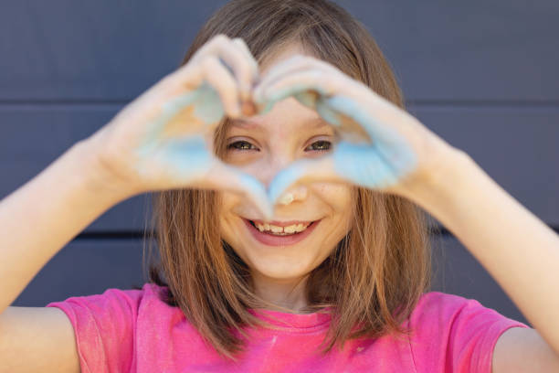 istock Cute Young Girl With Chalk On Hands 1222180582